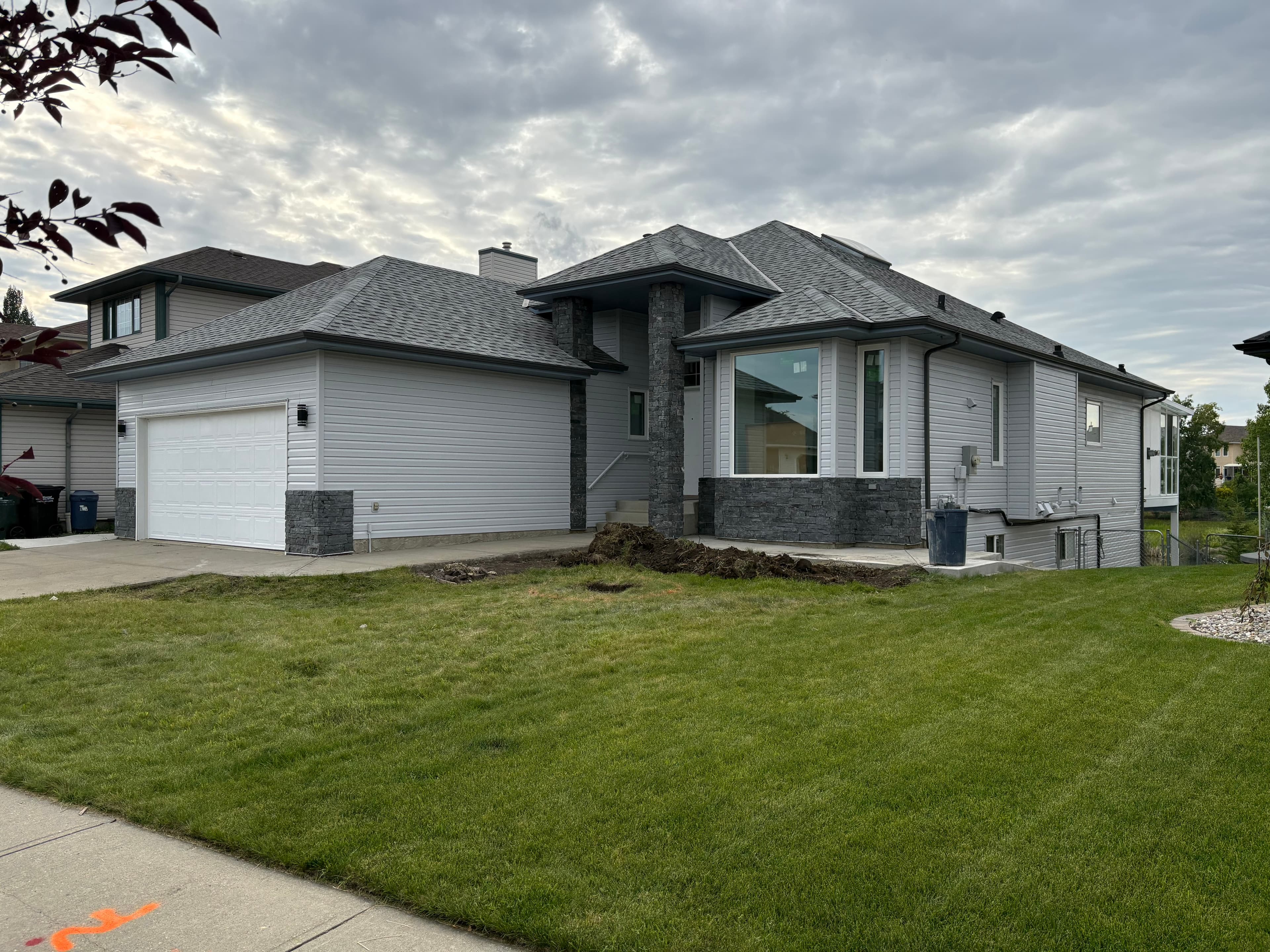 Exterior house painting with bold trim detail